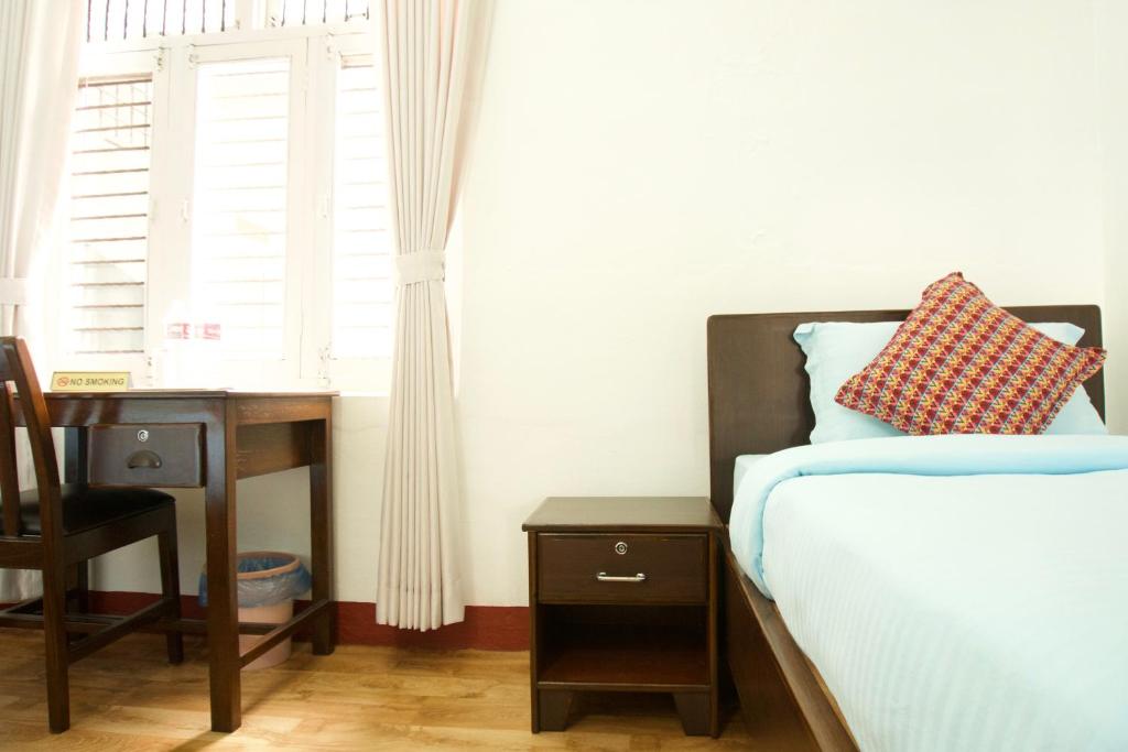 Ένα ή περισσότερα κρεβάτια σε δωμάτιο στο Hope Guest House