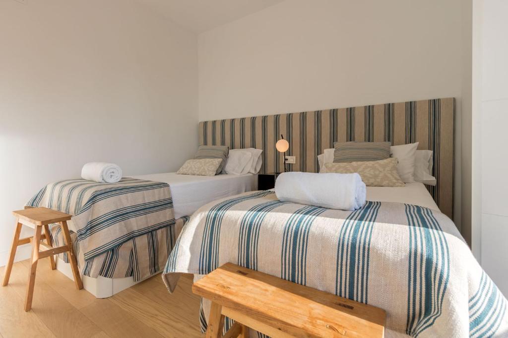 Postel nebo postele na pokoji v ubytování Ohliving Alcazar