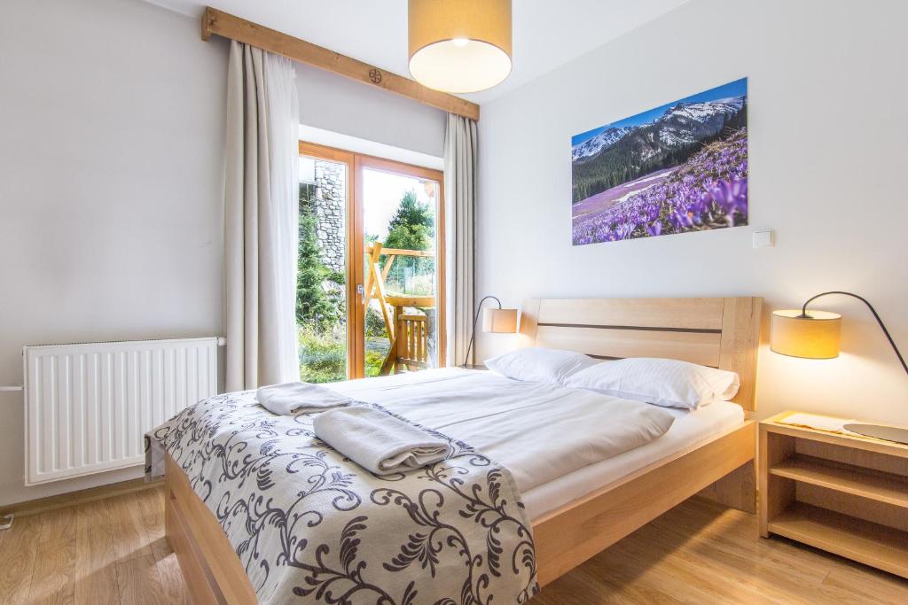 Posteľ alebo postele v izbe v ubytovaní Apartamenty Smrekowa Lux Zakopane