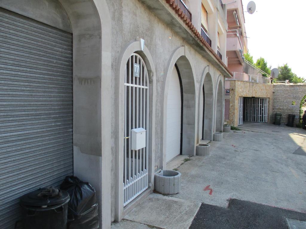 a gate on the side of a building at Apartments Meni in Drage