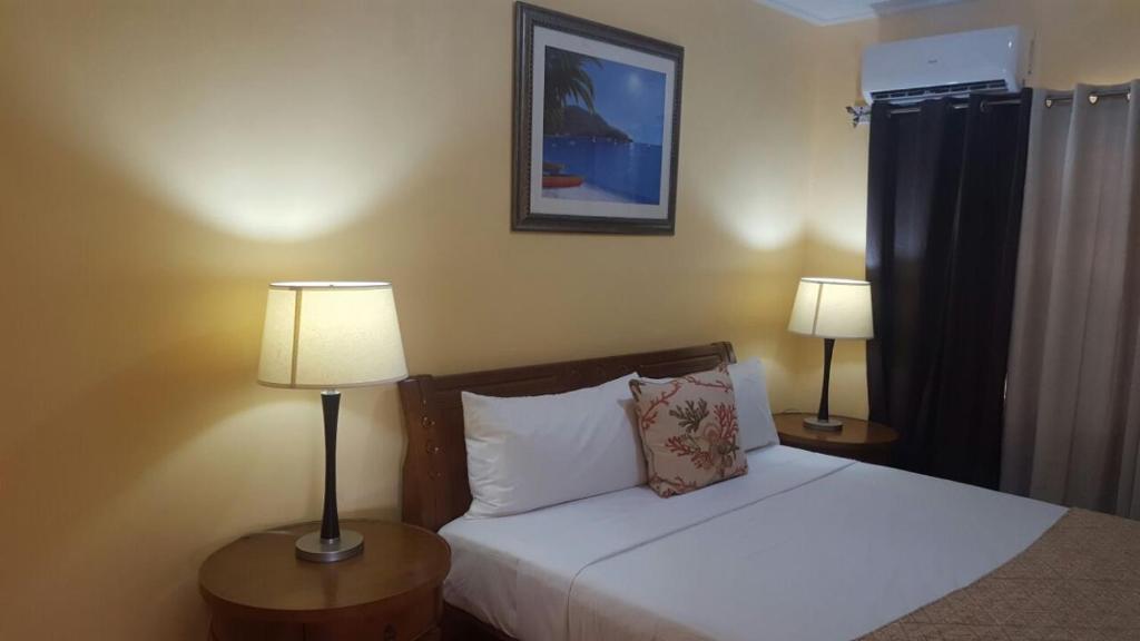 Voodi või voodid majutusasutuse Tropical Home Oasis toas