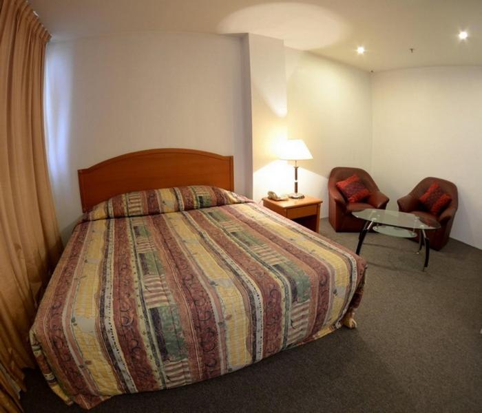 Postel nebo postele na pokoji v ubytování Kawan Hotel