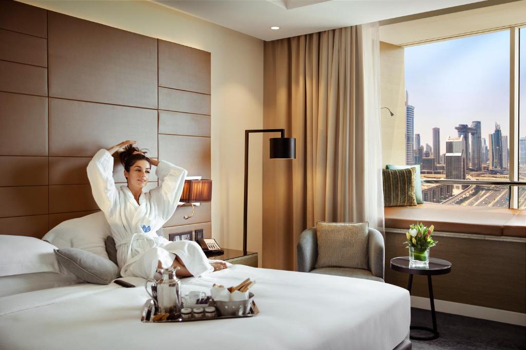 Postel nebo postele na pokoji v ubytování Towers Rotana - Dubai