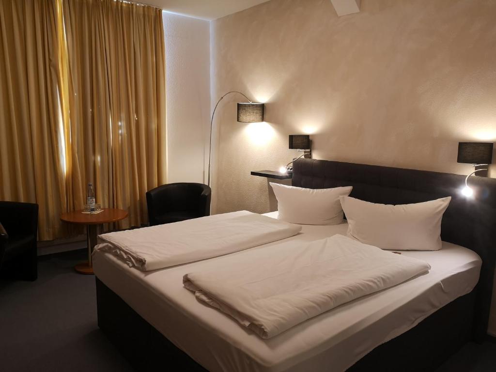 Voodi või voodid majutusasutuse Hotel Zur Alten Druckerei toas