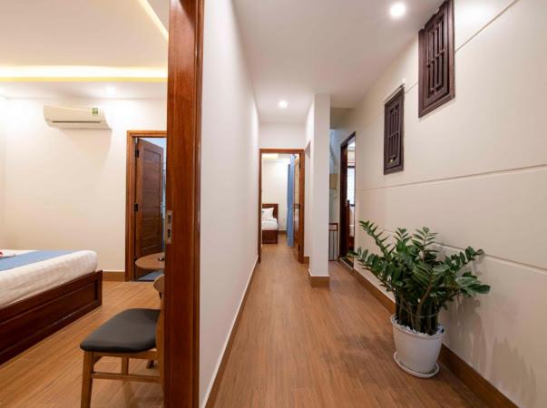 Postel nebo postele na pokoji v ubytování Hoi An Impression Homestay