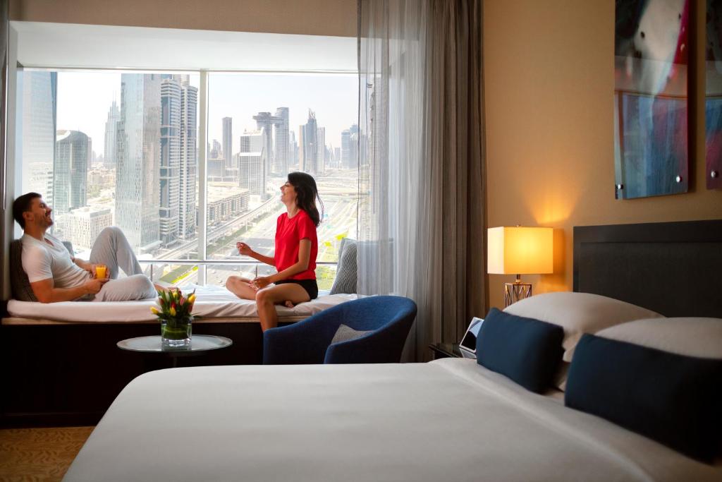 Postel nebo postele na pokoji v ubytování Towers Rotana - Dubai