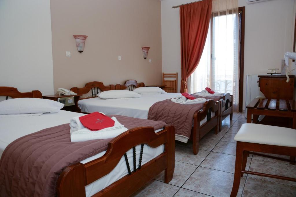 Postel nebo postele na pokoji v ubytování Poseidonio Hotel