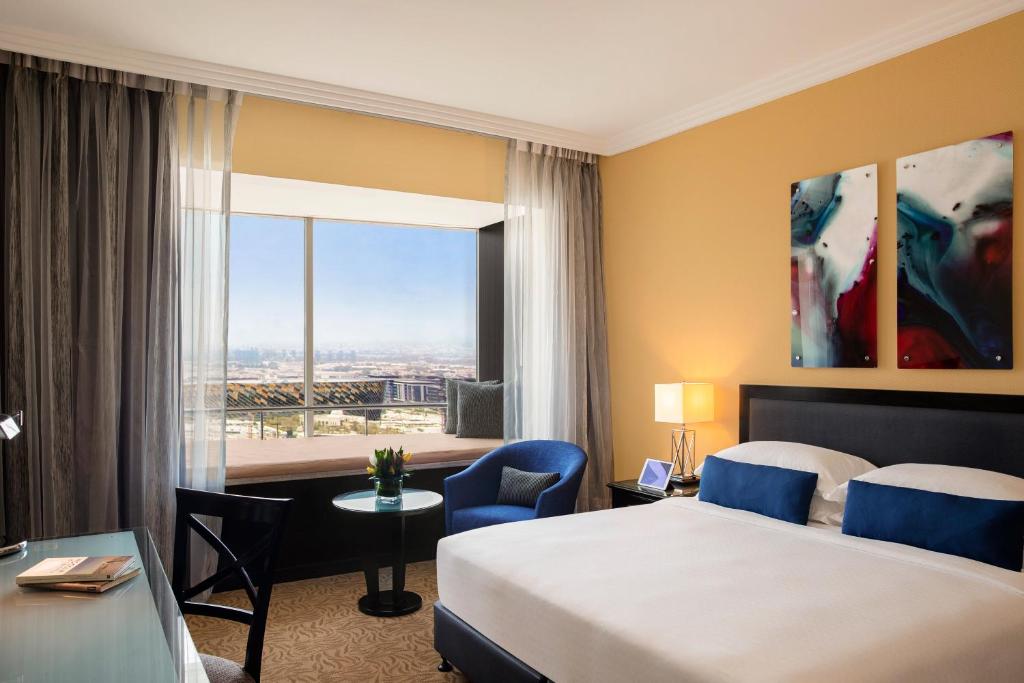 Postel nebo postele na pokoji v ubytování Towers Rotana - Dubai