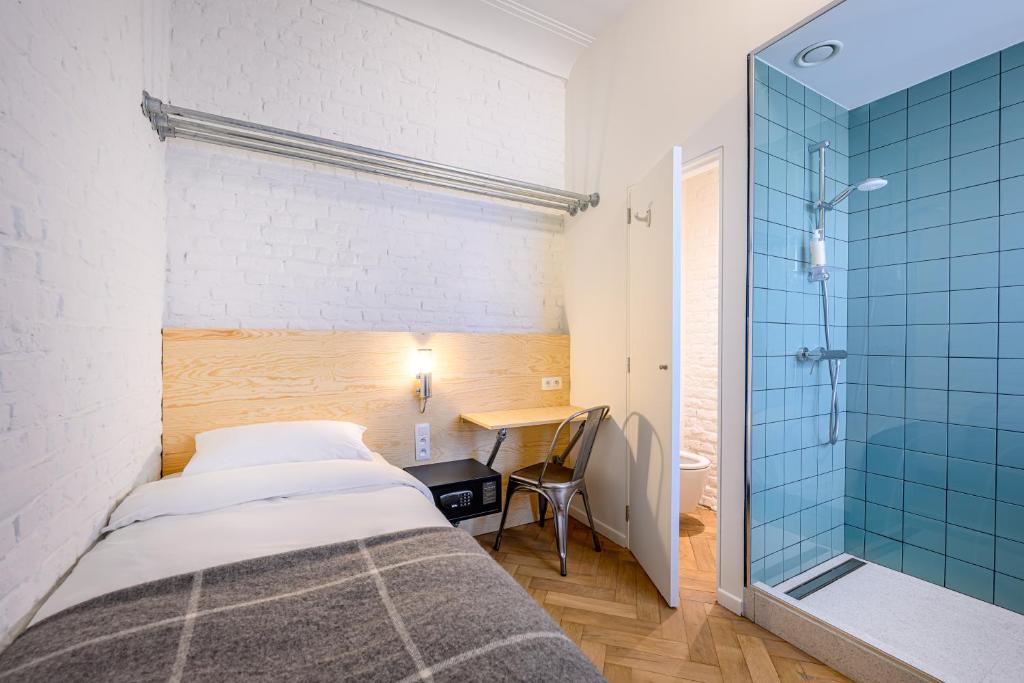 Postel nebo postele na pokoji v ubytování Hotel La Grande Cloche