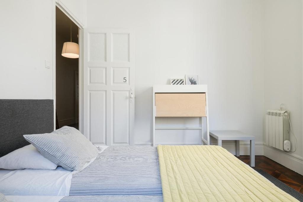 Postel nebo postele na pokoji v ubytování Baixa24 · City Center Private Sun Deck Apartment