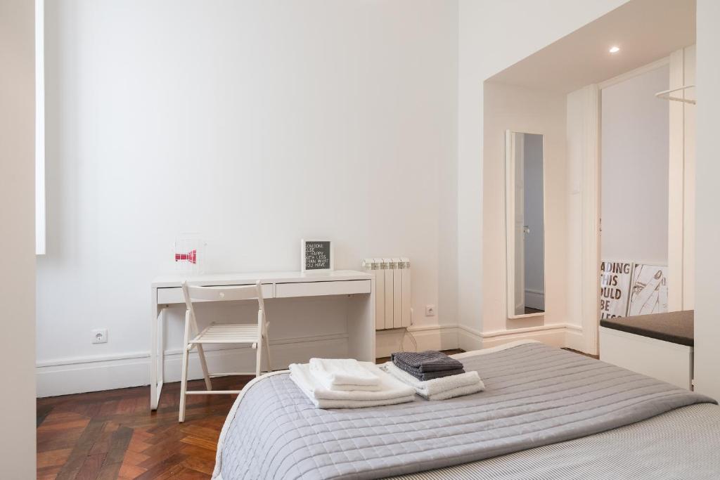 Postel nebo postele na pokoji v ubytování Baixa24 · City Center Private Sun Deck Apartment