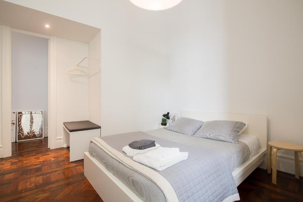 Postel nebo postele na pokoji v ubytování Baixa24 · City Center Private Sun Deck Apartment