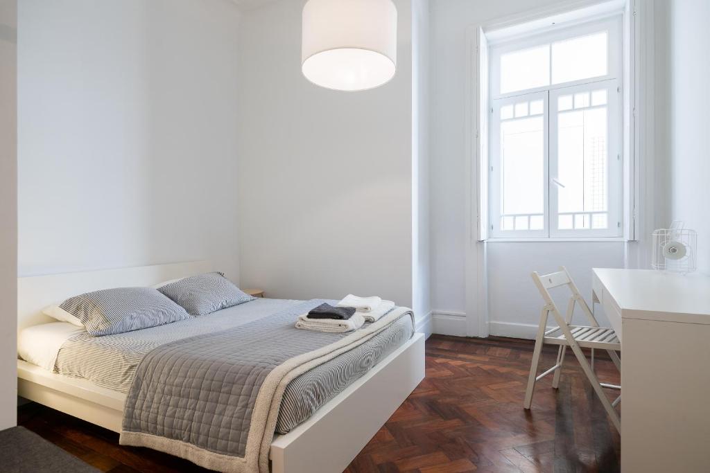 Postel nebo postele na pokoji v ubytování Baixa24 · City Center Private Sun Deck Apartment