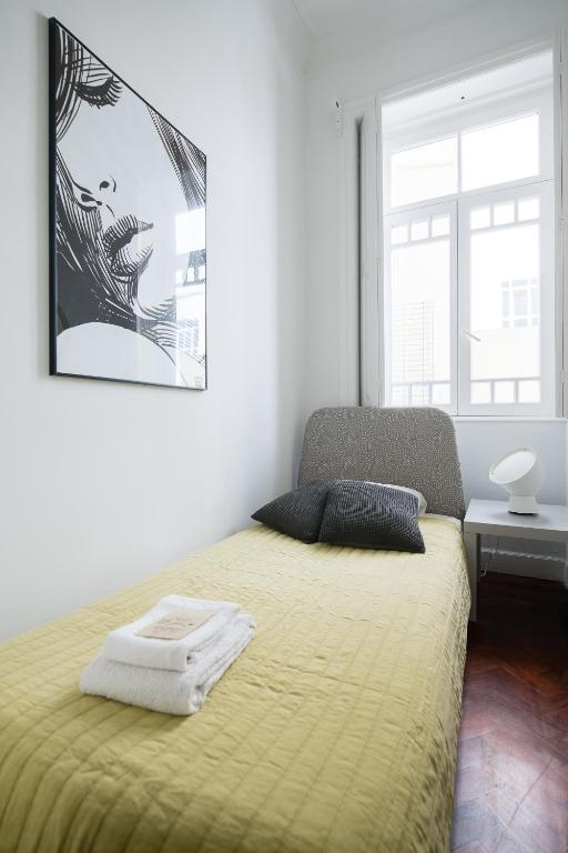 Postel nebo postele na pokoji v ubytování Baixa24 · City Center Private Sun Deck Apartment