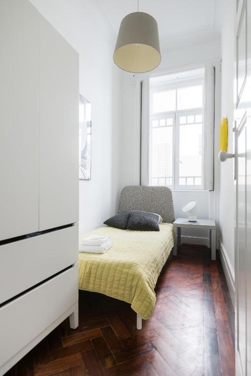 Postel nebo postele na pokoji v ubytování Baixa24 · City Center Private Sun Deck Apartment