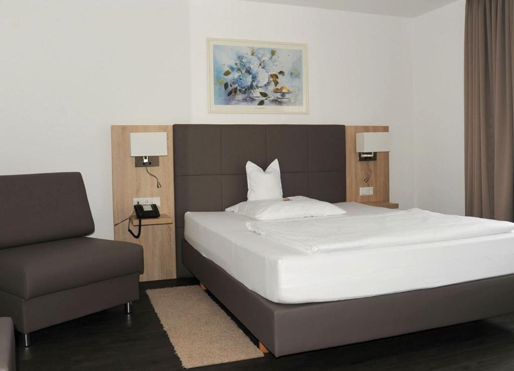 Postel nebo postele na pokoji v ubytování Hotel Hamann