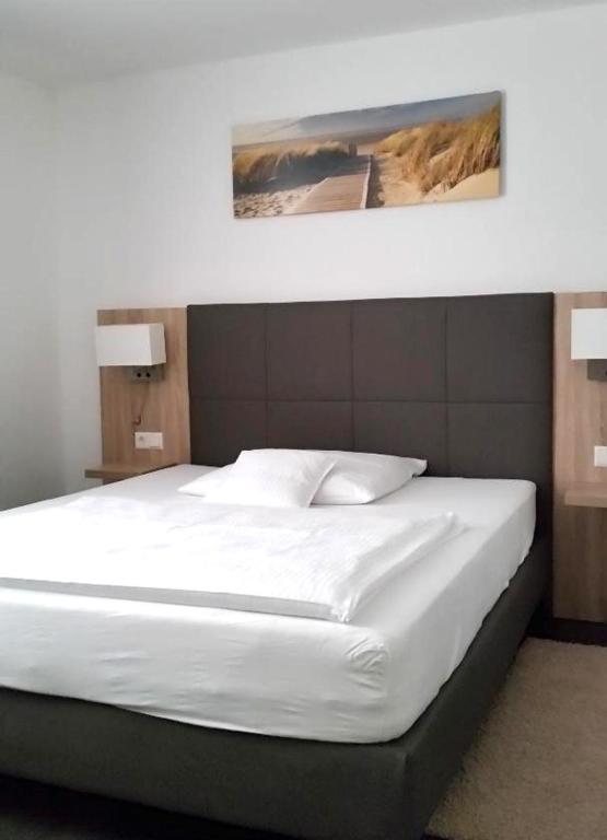 Postel nebo postele na pokoji v ubytování Hotel Hamann