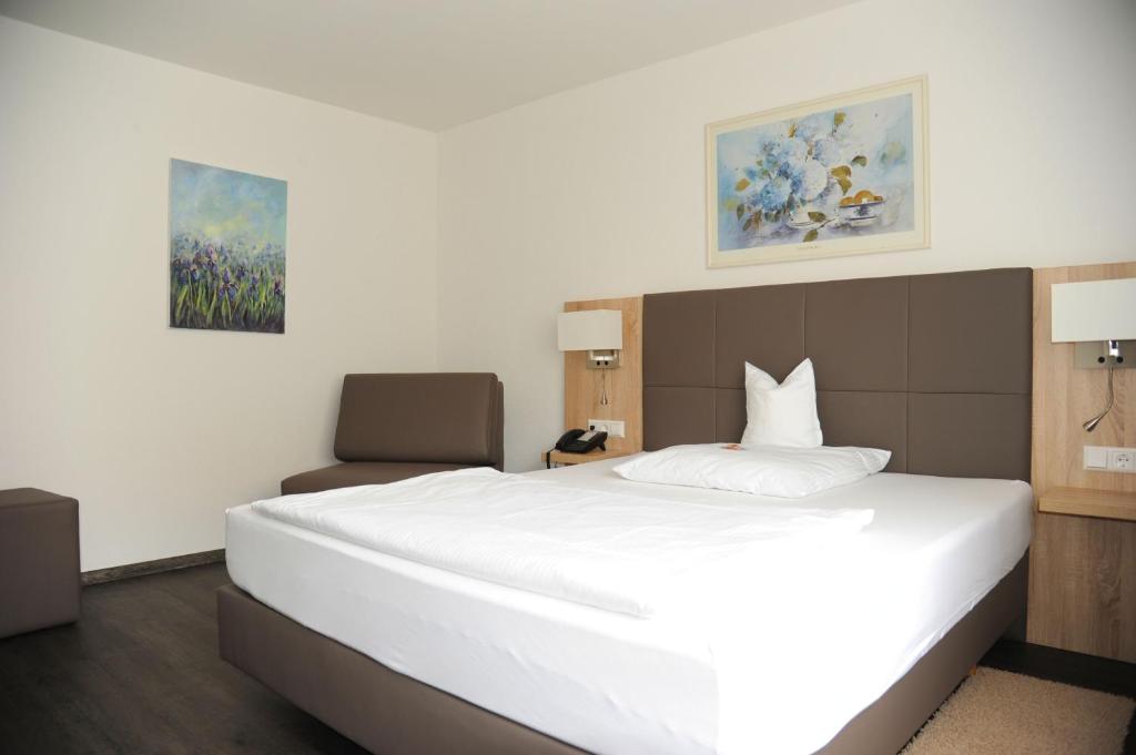 Postel nebo postele na pokoji v ubytování Hotel Hamann