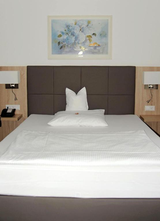 Postel nebo postele na pokoji v ubytování Hotel Hamann