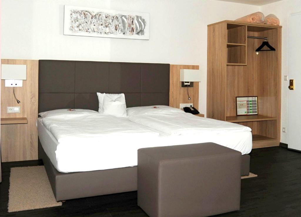 Postel nebo postele na pokoji v ubytování Hotel Hamann