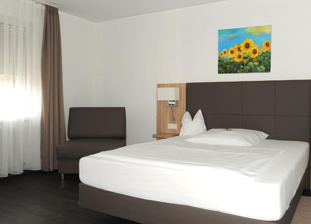 Postel nebo postele na pokoji v ubytování Hotel Hamann