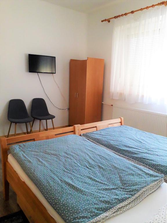 Postel nebo postele na pokoji v ubytování Kristály Vendégház