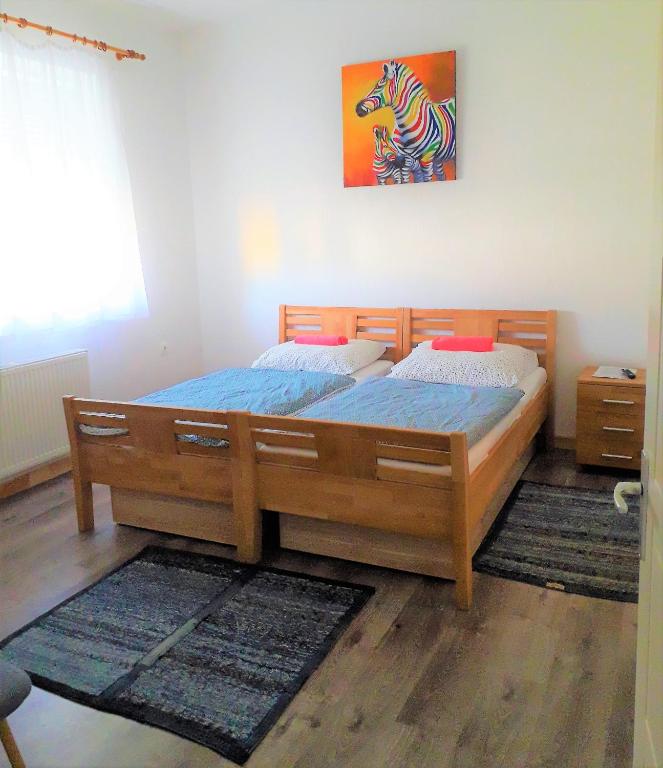Postel nebo postele na pokoji v ubytování Kristály Vendégház