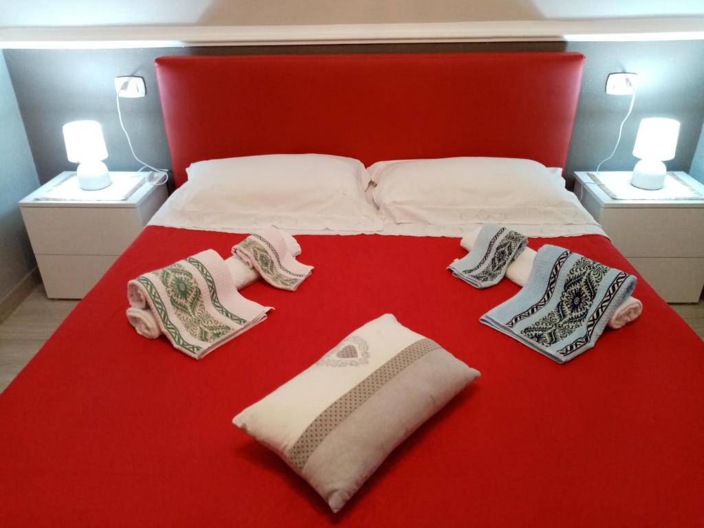 Кровать или кровати в номере Appartamento rosariomaria