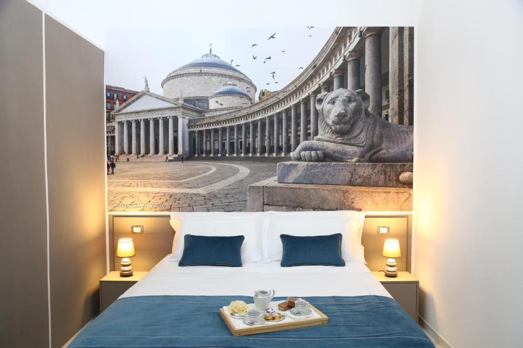 Posteľ alebo postele v izbe v ubytovaní Palazzo Caracciolo del Sole