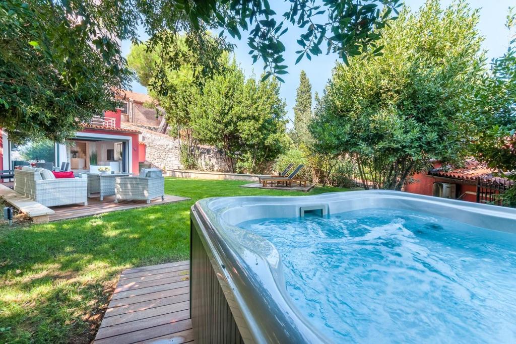a hot tub in the backyard of a house at Villa Fema in Rovinj