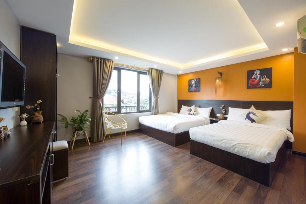 Postel nebo postele na pokoji v ubytování HeLLo Sapa Hotel