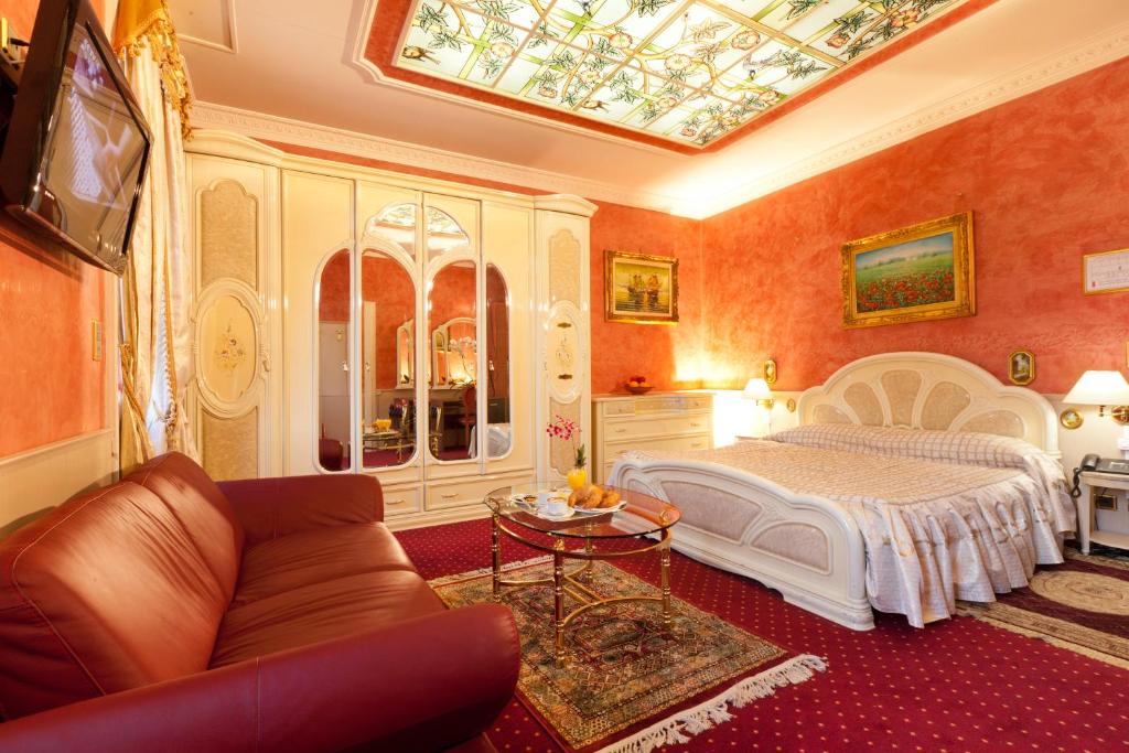 Postel nebo postele na pokoji v ubytování Hotel Victoria