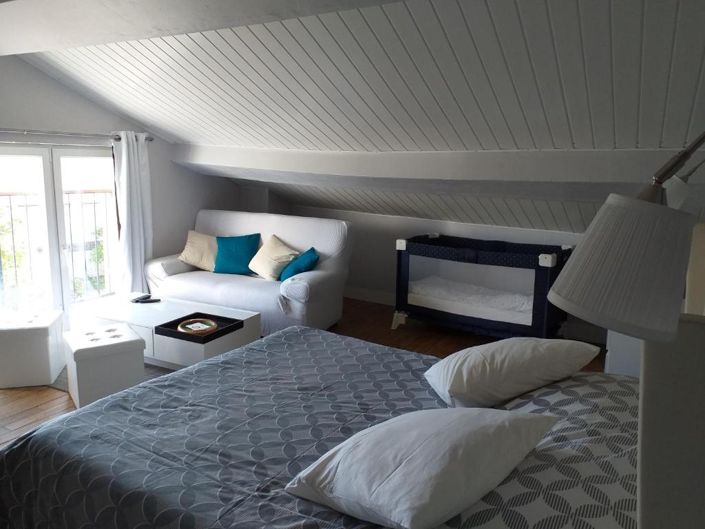 Ένα ή περισσότερα κρεβάτια σε δωμάτιο στο Chambres d'Hôtes Selon Morphee