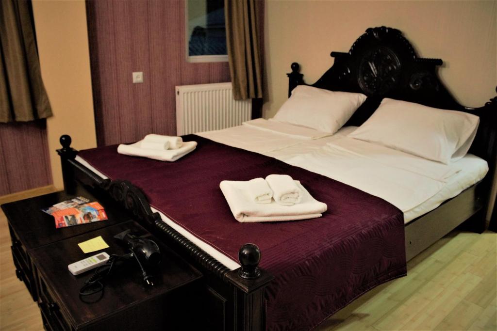 Postel nebo postele na pokoji v ubytování Twins Hotel