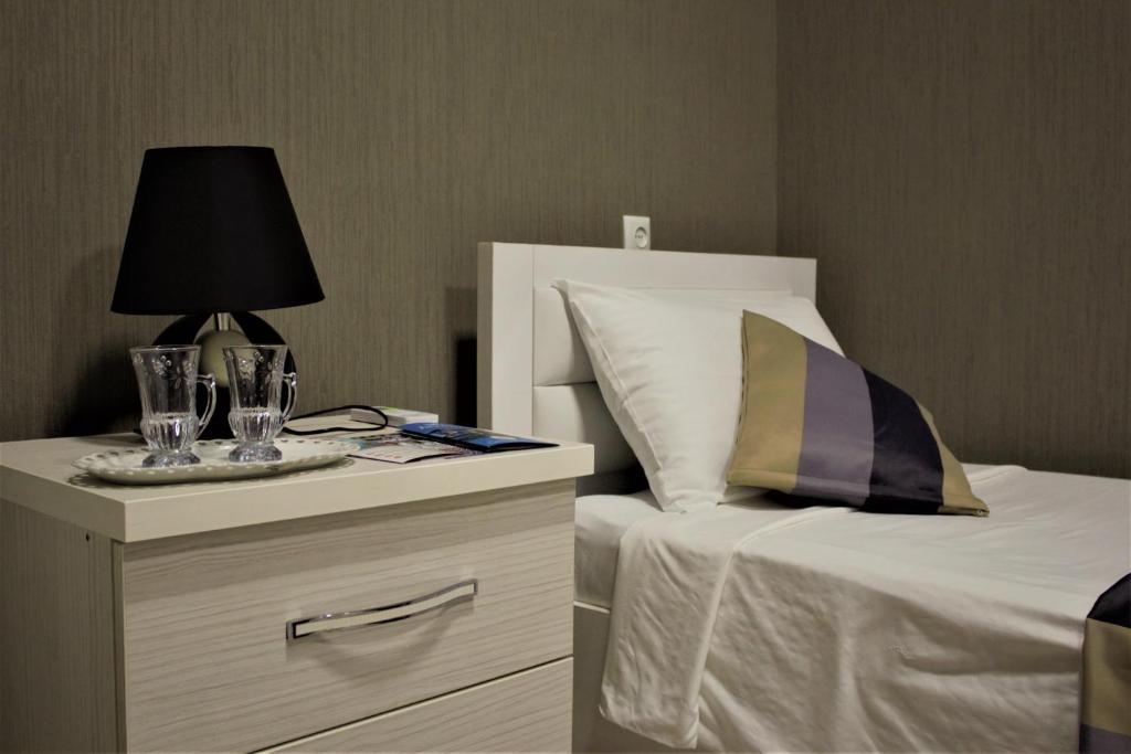 Postel nebo postele na pokoji v ubytování Twins Hotel