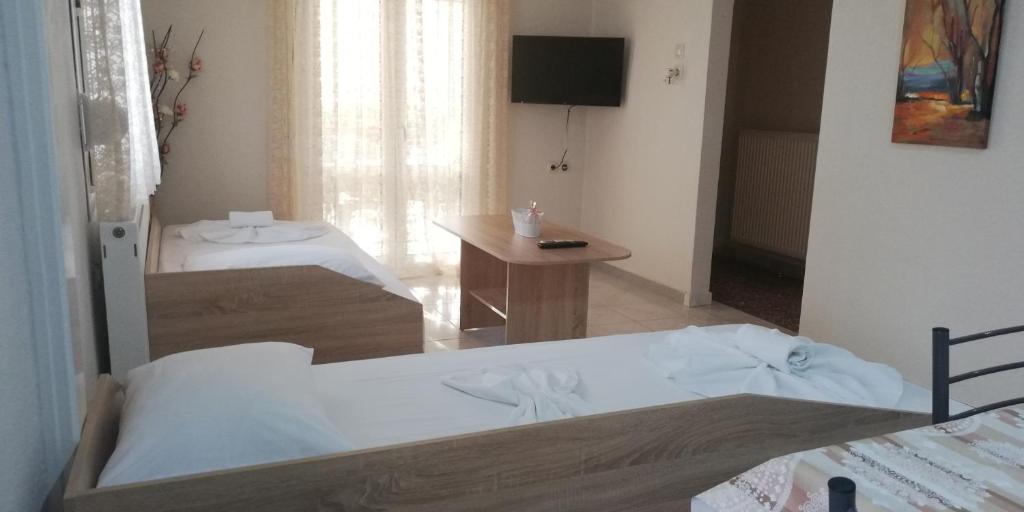 Postel nebo postele na pokoji v ubytování Periklis House