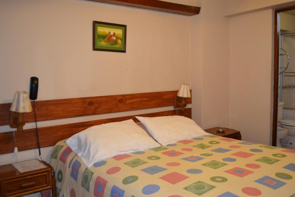 Postel nebo postele na pokoji v ubytování Suite Service Apart Hotel