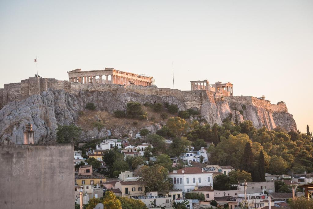 a castle perched on top of a mountain at A Room with a View in Athens