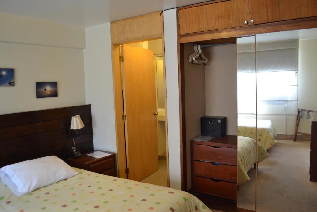 Postel nebo postele na pokoji v ubytování Suite Service Apart Hotel