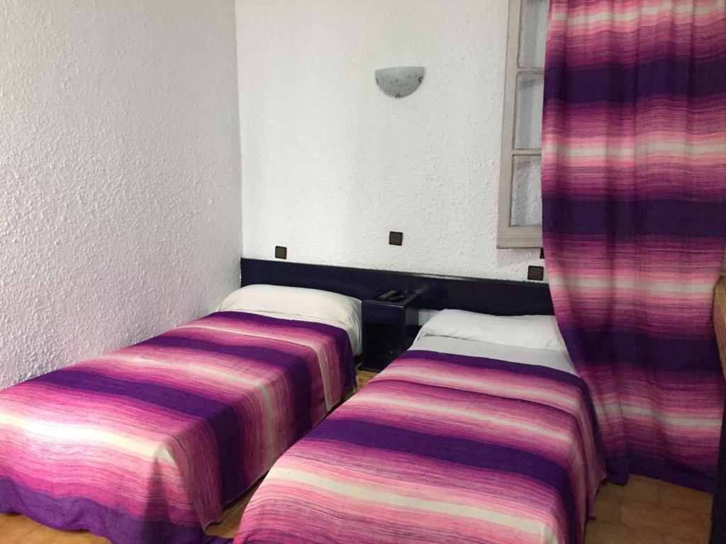 Una cama o camas en una habitación de HOTEL REGINA