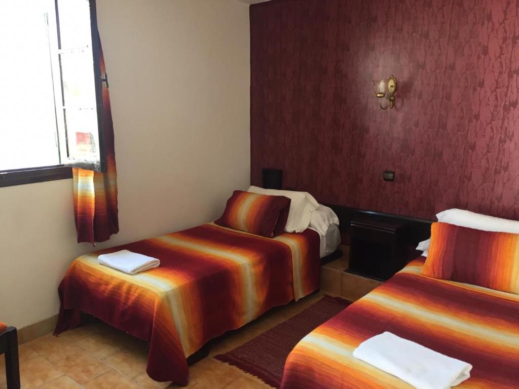 Una cama o camas en una habitación de HOTEL REGINA