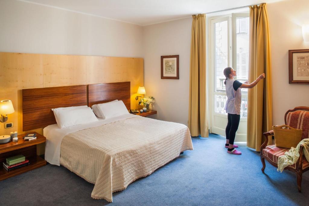 Postel nebo postele na pokoji v ubytování Phi Hotel Palio