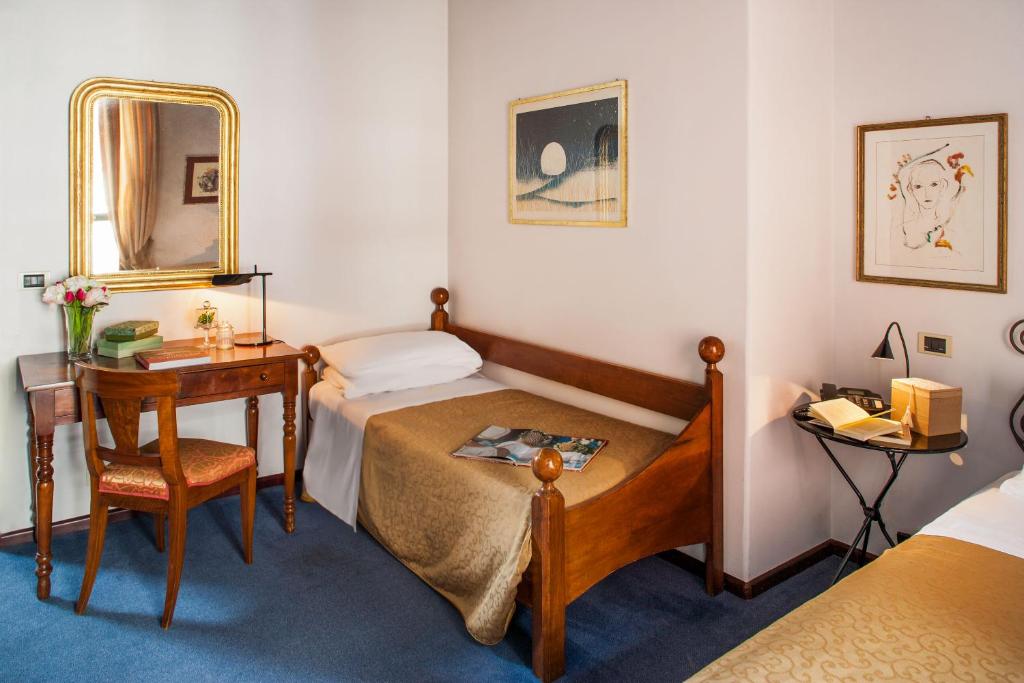 Postel nebo postele na pokoji v ubytování Phi Hotel Palio