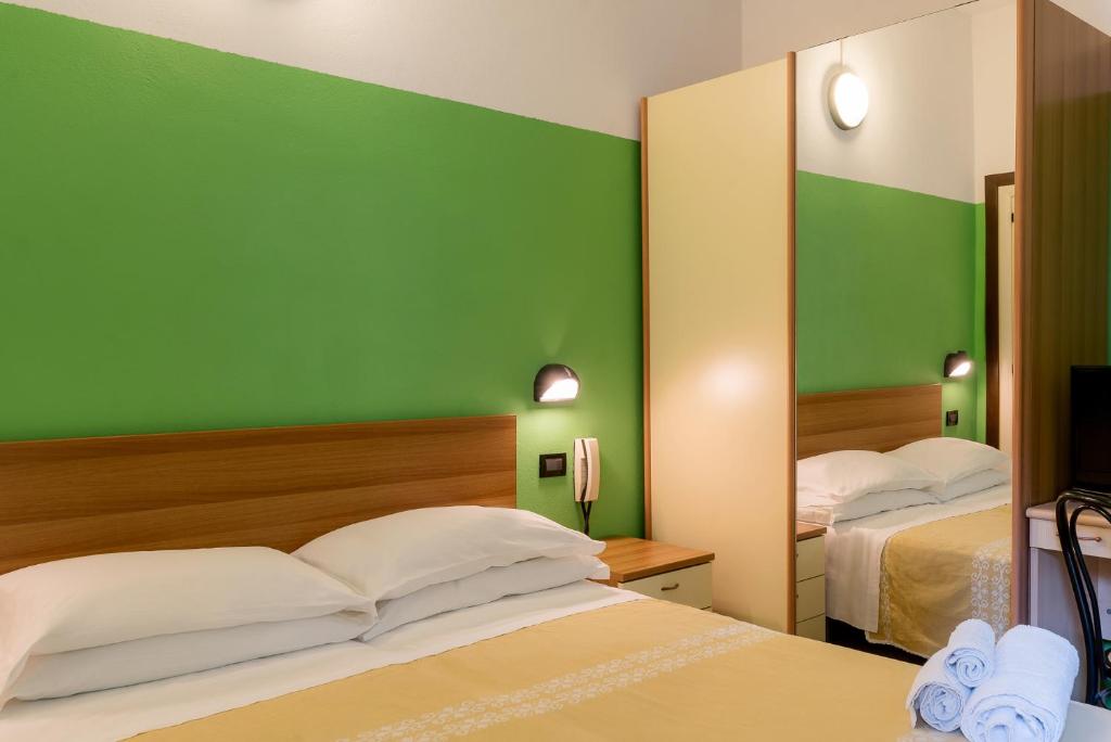 Postel nebo postele na pokoji v ubytování Hotel T Depandance