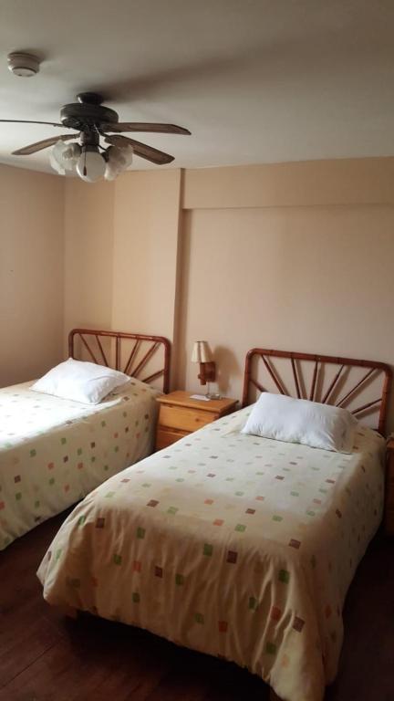 Postel nebo postele na pokoji v ubytování Suite Service Apart Hotel