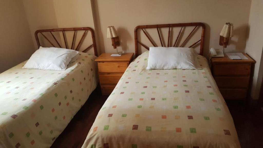 Postel nebo postele na pokoji v ubytování Suite Service Apart Hotel