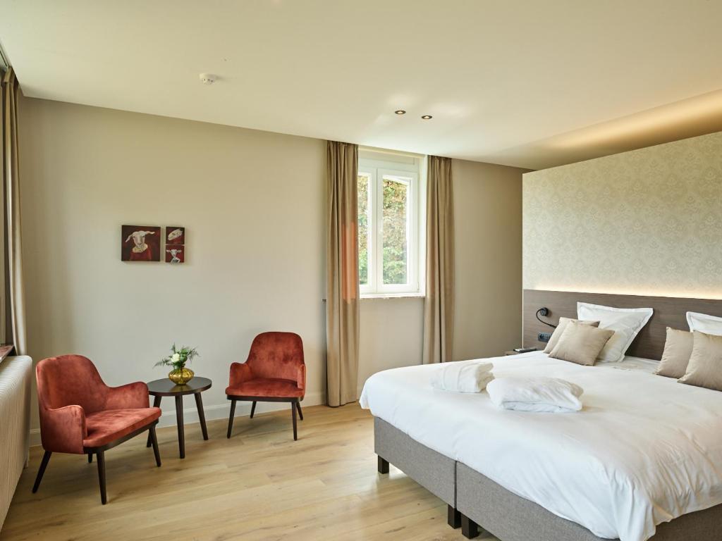 Postel nebo postele na pokoji v ubytování Boutique Hotel Ter Wallen