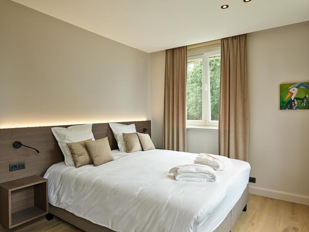 Postel nebo postele na pokoji v ubytování Boutique Hotel Ter Wallen