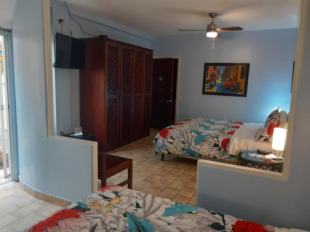 Postel nebo postele na pokoji v ubytování Hotel Casa 69