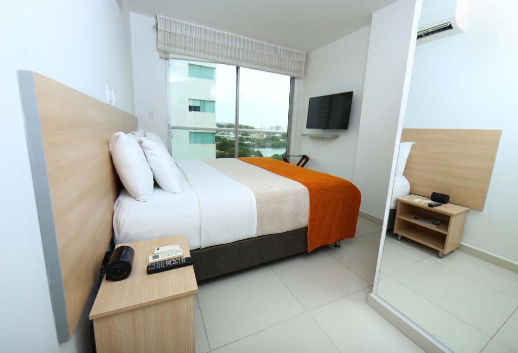 En eller flere senge i et værelse på Hotel Cabreromar By GEH Suites
